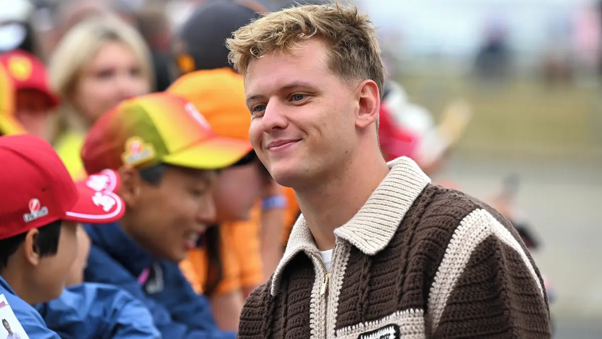 Mick Schumacher in racing gear featured in motorsport reporting